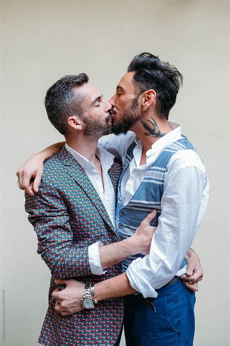 Kiss Between A Gay Couple In Love By Stocksy Contributor Michela