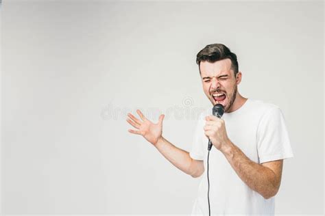 Nice Picture Of An Emotional Guy Singing In Microphone His Trying To