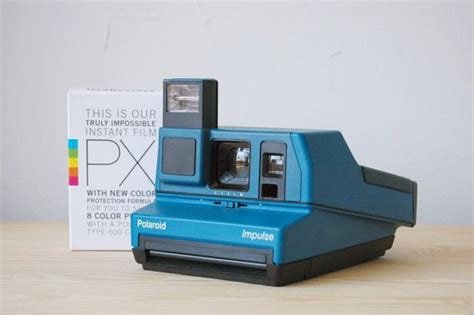Blue Polaroid Impulse Camera With Colour Film Pack By Lightandfade