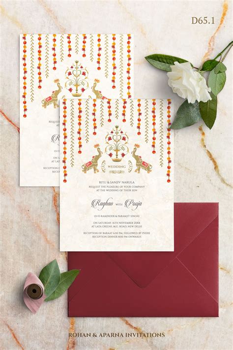 We, at indian wedding card, design breathtakingly beautiful wedding invitation cards. South Indian inspired wedding invitation concept with hanging flowe… in 2020 | Indian wedding ...