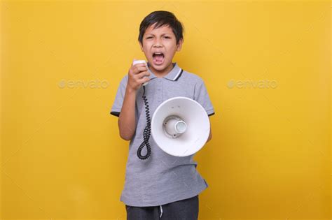 Boy Screaming Using Megaphone Stock Photo By Garakta Studio Photodune