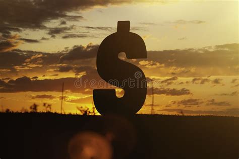 Dollar Money Sign At Sunset In The Rays Of The Setting Sun Sunset