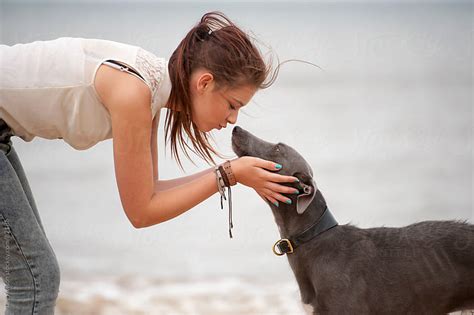 Teenage Girl Kissing Her Pet Dog By Lee Avison Stocksy United
