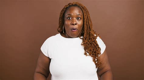 Surprised African American Female Touching Her Cheeks In Amazement Brown Background Slow