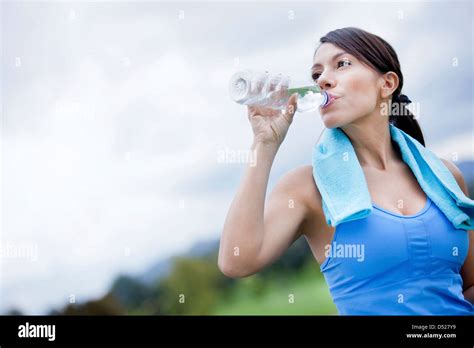 Woman Drinking Water After Exercise Stock Photo Alamy