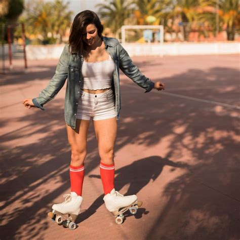 Free Photo Young Woman Balancing On The Roller Skate