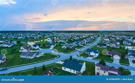 Midwest American Suburban Neighborhood Housing Aerial At Dusk Stock