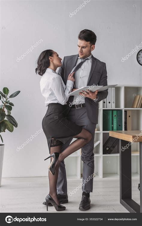 Sexy Secretary Standing Close Businessman While Seducing Him Office