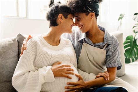 Married Lesbian Couple Expecting A Baby Pregnant Lesbian Couple Smiling And Embracing Each