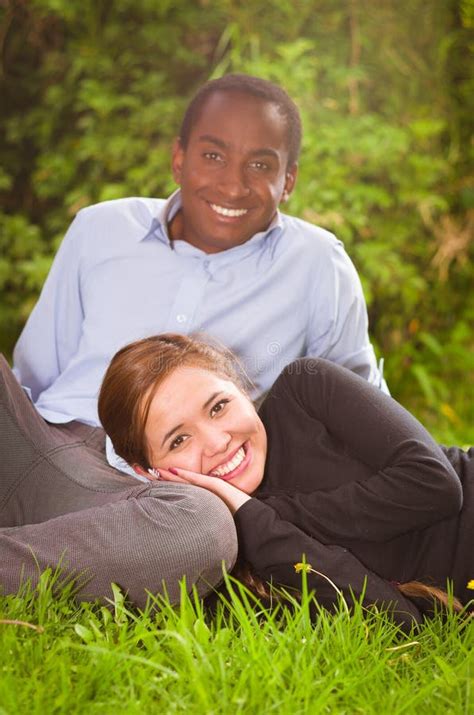 Beautiful Young Interracial Couple Sitting Garden Environment Embracing