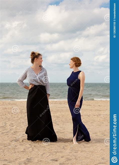 two women beach sand sea talking de panne belgium stock image image of profile black 128288155