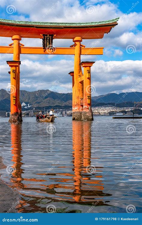 Floating Red Giant Grand O Torii Gate Stands In Miyajima Island Bay