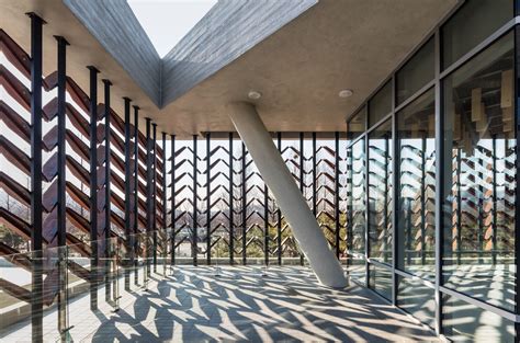 Moveable Wooden Screens Are Set Into Concrete Facades Of Wood Museum