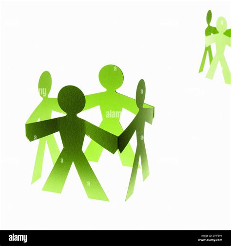 Papercuts Paper Cut Out People With Joined Hands Stock Photo Alamy