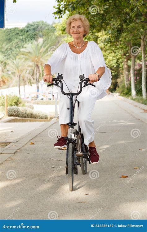 Mature Woman Cycling Stock Photo Image Of Interested