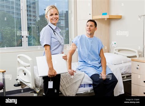 Nurse And Patient In Hospital Ward Stock Photo Alamy