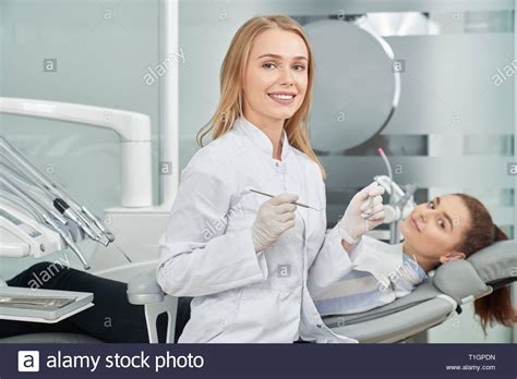 Download This Stock Image Charming Female Dentist Posing Beautiful
