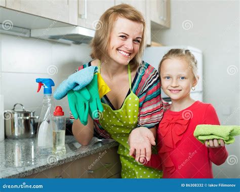 Mom And Little Girl Cleaning At Kitchen Stock Photo Image Of Gloves