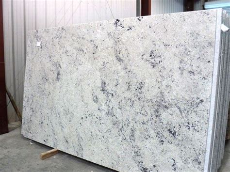 This stone is especially good for counter tops and bar tops, interior wall panels,monuments this white granite will have slight veining or consolidation of the dark crystals within these slabs. Colonial White granite slab 65 (With images) | White ...