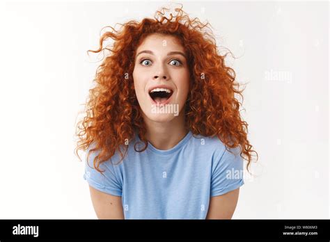 Charismatic Beautiful Redhead Woman With Curly Hairstyle Making