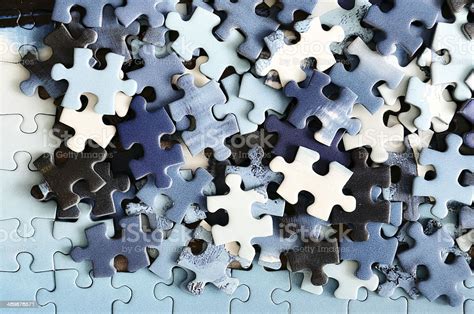 Pile Of Unfinished Puzzle Pieces In Detail Stock Photo Download Image