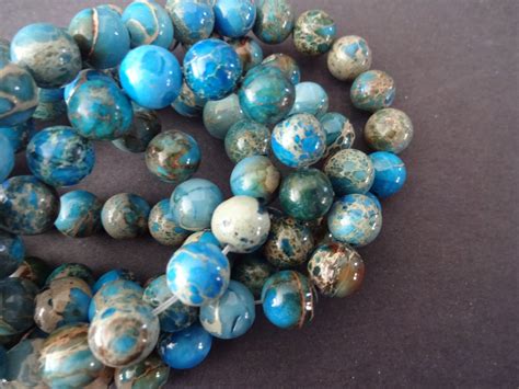 8mm Natural Regalite Blue Ball Beads Dyed And Heated 16 Inch Strand