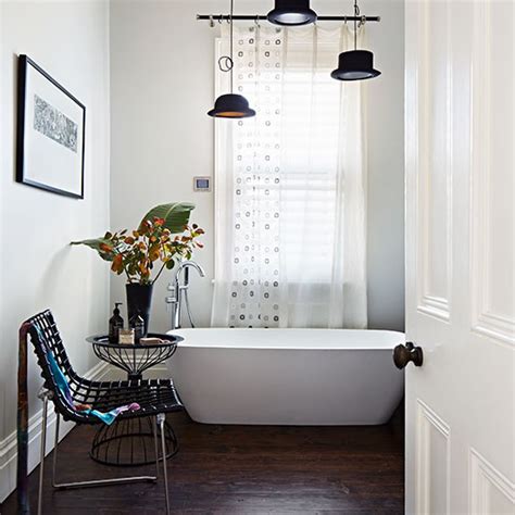Continue to 15 of 19 below. White bathroom with dark wood floor | Bathroom decorating | housetohome.co.uk