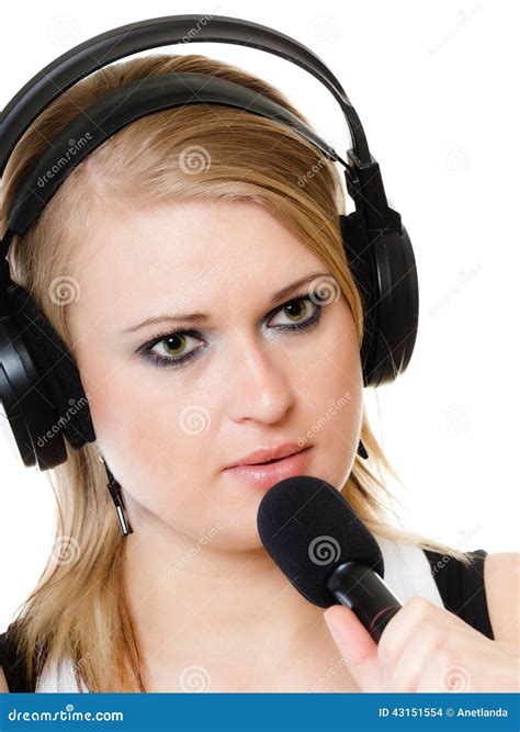 Girl Singer Musician With Headphones Singing To Microphone Stock Photo