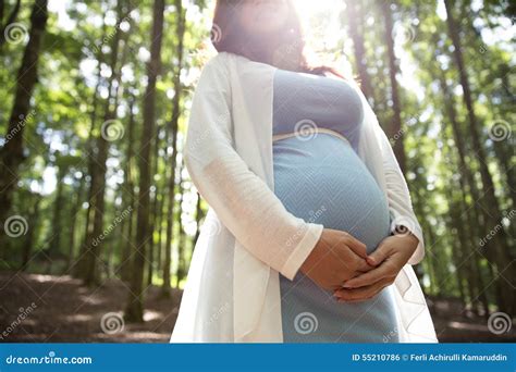 Asian Pregnant Woman Look Up In The Forest Hands On The Belly Stock Photo Image Of Ocean