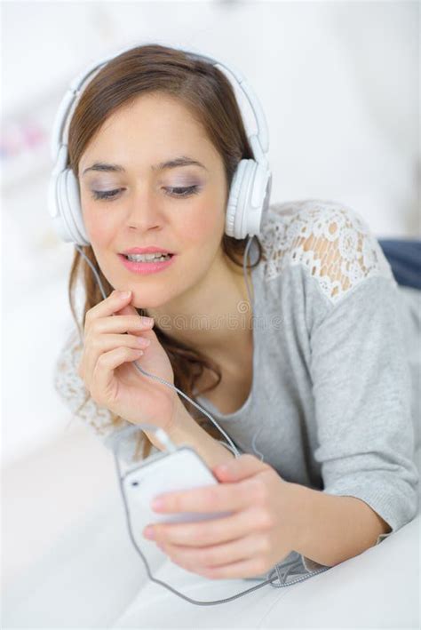 Attractive Female Listening To Music On Headphones Stock Photo Image