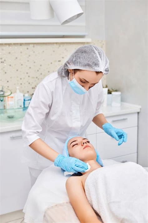 Beautician Cleanses Skin Of Face Of Woman Stock Photo Image Of Face