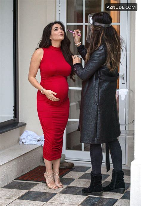 Casey Batchelor Sexy Shows Off Her Baby Bump In A Red Dress During A