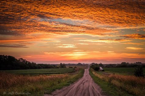 Stunning Sunrise Over A Long Country Road In Cloud County Kansas
