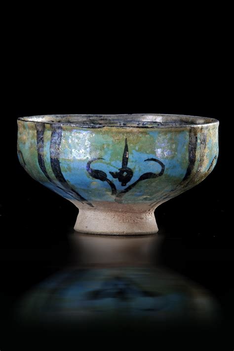 A Kashan Turquoise And Black Decorated Bowl Persia 13th Century