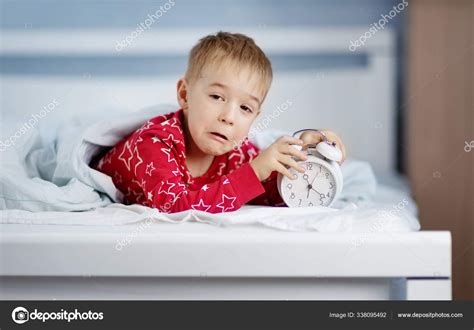 Sleepy Boy Lying In Bed With Blue Beddings Stock Photo By ©candy18