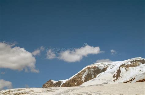 Snow Capped Peaks Of The Caucasus Mountains In Russia Stock Image