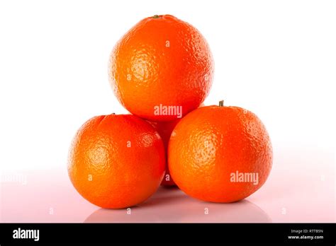 Four Oranges Stacked Isolated On White Stock Photo Alamy