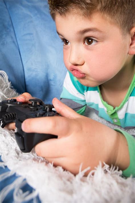 Little Boy Playing Video Games Stock Photo Image Of Emotion Playful