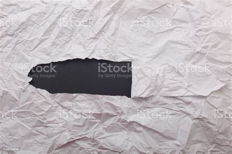 White Crumpled Paper Texture With Hole In The Paper With Torn Sides