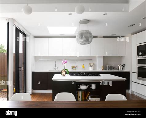 Modern Kitchen With Island Unit And White Fitted Units Stock Photo Alamy