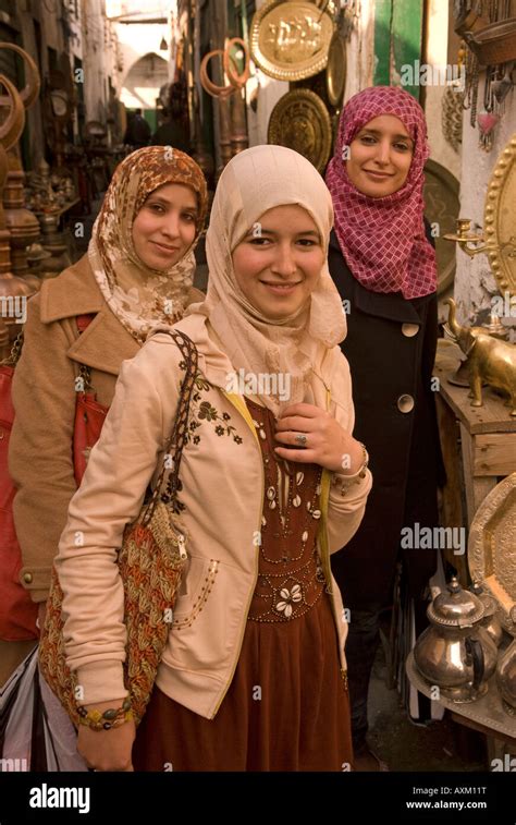 Three Young Libyan Women In The Copper Souk Of The Old Town Or Medina