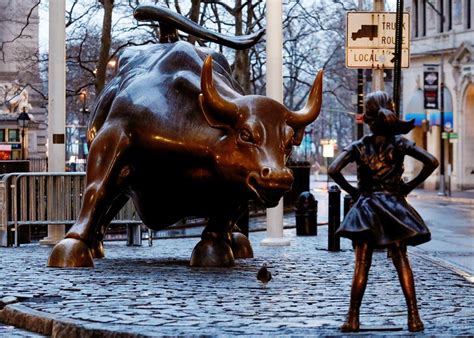 A Bronze Little Girl Sculpture Joins The Charging Bull On Wall Street