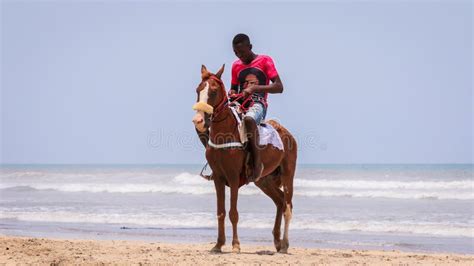Local African People Having Fun On The Ghana Ocean Coastline Editorial
