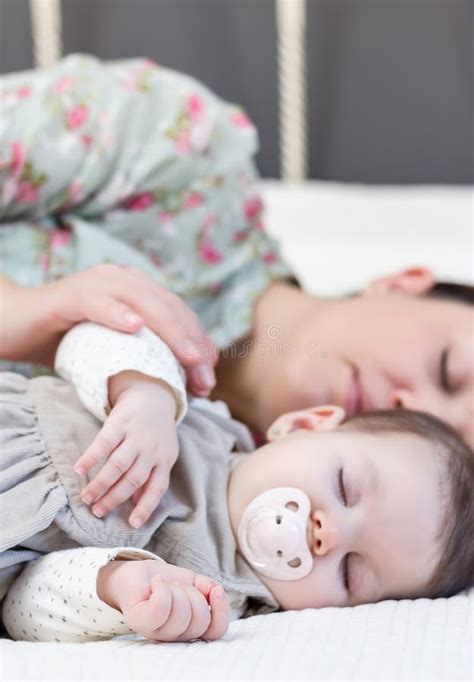 Young Mother And Her Baby Girl Sleeping In The Bed Stock Image Image