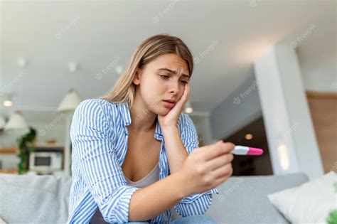 Premium Photo Shocked Woman Looking At Control Line On Pregnancy Test Single Sad Woman