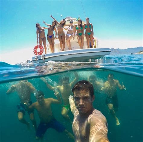 Best Travel Selfie Ever Internet Shocked By What Lurks Beneath This Boat Of Bikini Babes