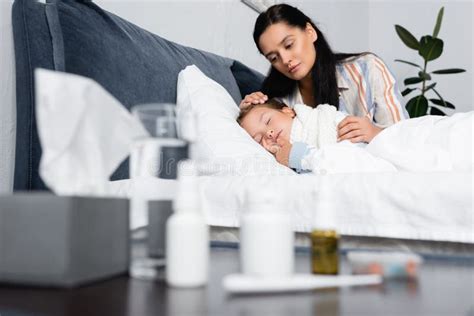 Mother Hugging Sick Daughter Sleeping In Stock Image Image Of Home