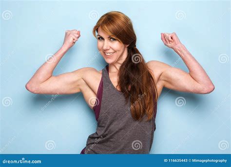 Happy Mature Woman Flexing Bicep Muscles Stock Image Image Of Flexing