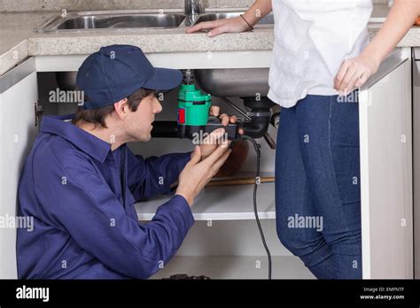 Two Plumbers Working Stock Photo Alamy