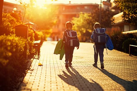 Two Little Boys Returning From School Stock Photo - Download Image Now ...